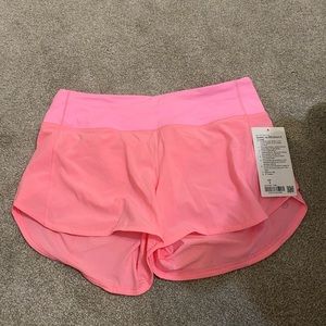 Neon pink Lululemon shorts